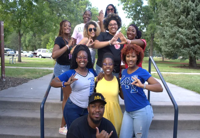 BAACC students posing together on the steps outside